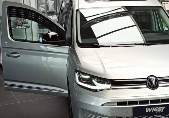 VW insert on the left with grille for ventilation with fly protection in the VW Caddy 5 / California - Wiest Shop for camper and van equipment