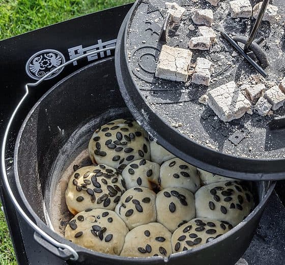 Petromax Dutch Oven F18-T used as an oven - Dutch oven with flat bottom - cast iron with lid - ideal for fireplaces on camping holidays | Wiest online shop for campers