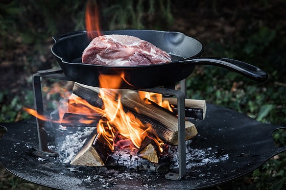 Cooking stand over fire with pan